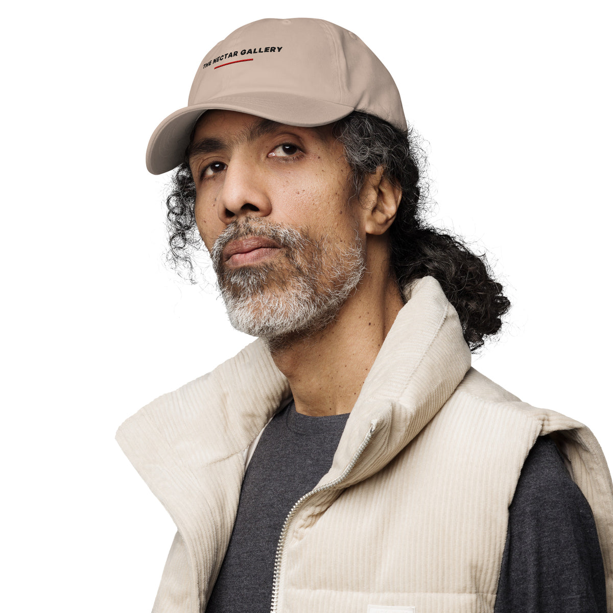 The Nectar Gallery wordmark cap being worn